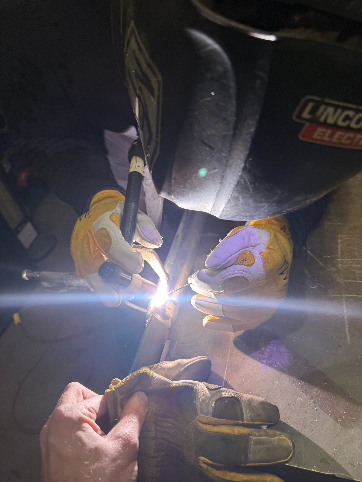 Precision TIG welding close-up — custom fabrication Hampton Roads
